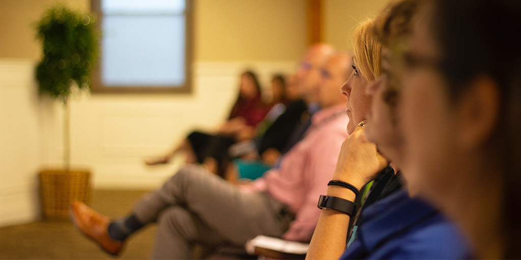 people attending a seminar, source: